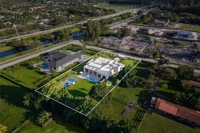 a balcony with lots of green garden view
