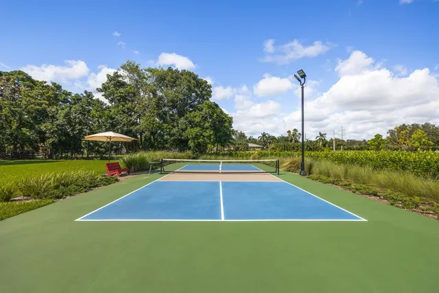 a view of a house with a backyard porch and sitting area