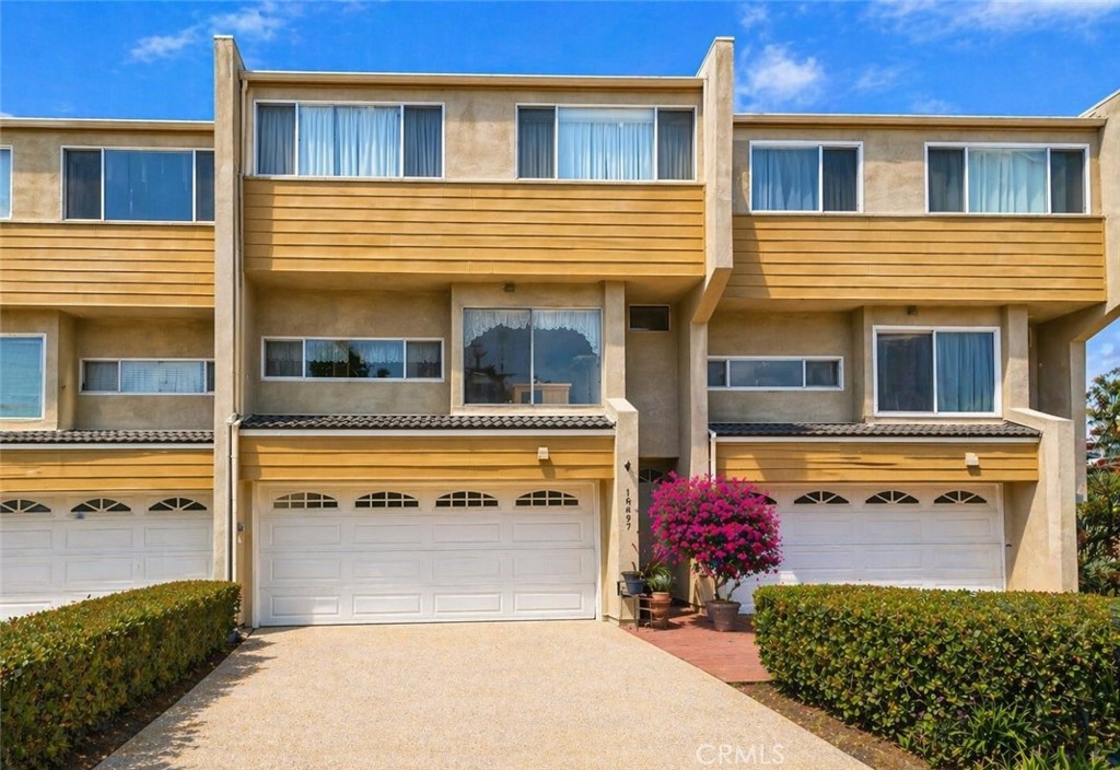 18697 Club Huntington Beach, CA 92648 - Photo 1 of 17 a view of front door and small yard