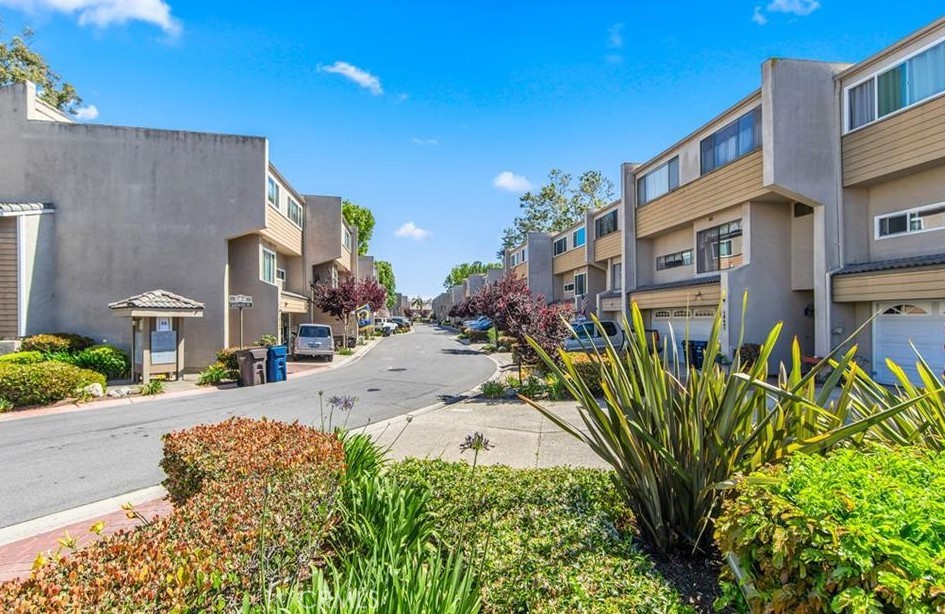 18697 Club Huntington Beach, CA 92648 - Photo 14 of 17 a view of a street with potted plants and more windows
