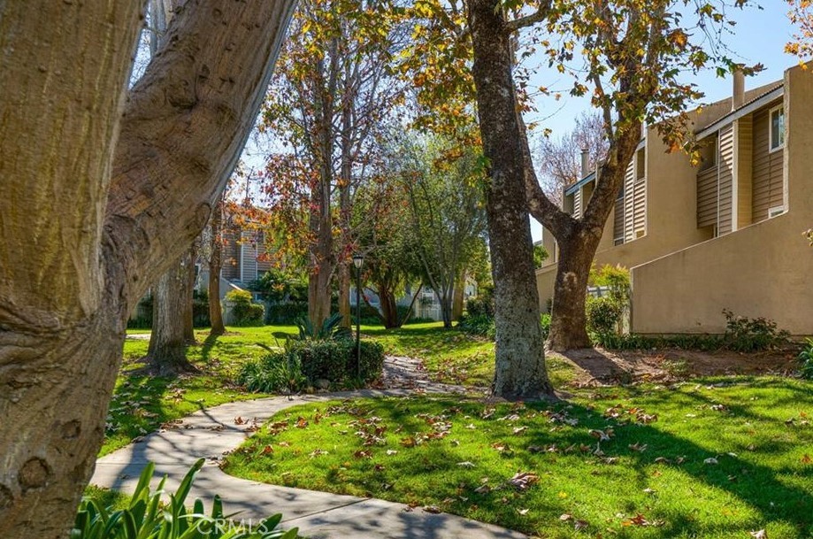 18697 Club Huntington Beach, CA 92648 - Photo 15 of 17 a backyard of a house with lots of green space