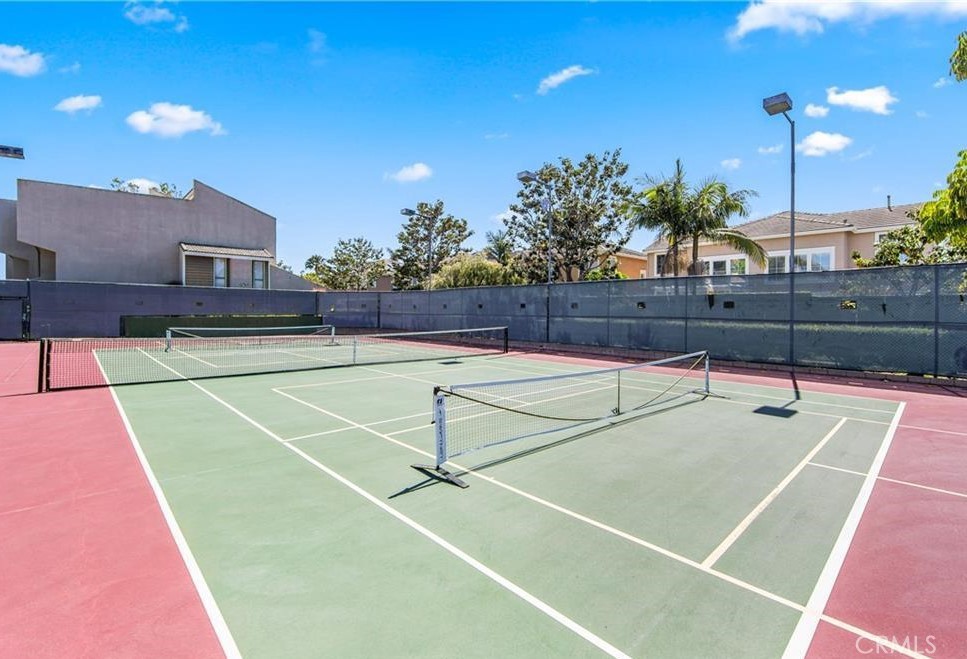 18697 Club Huntington Beach, CA 92648 - Photo 16 of 17 a view of a tennis court