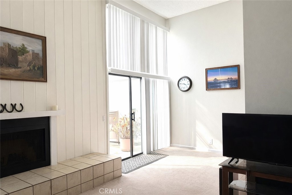 18697 Club Huntington Beach, CA 92648 - Photo 3 of 17 a view of an empty room with furniture and a window