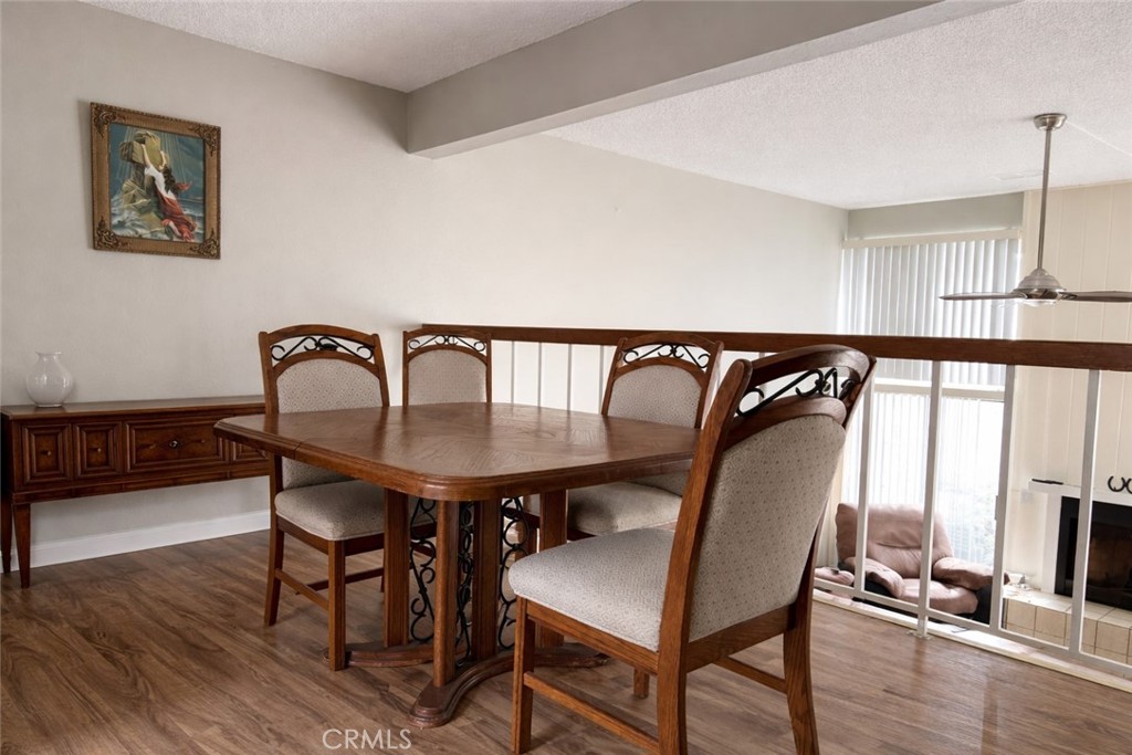 18697 Club Huntington Beach, CA 92648 - Photo 4 of 17 a view of a dining room with furniture window and wooden floor