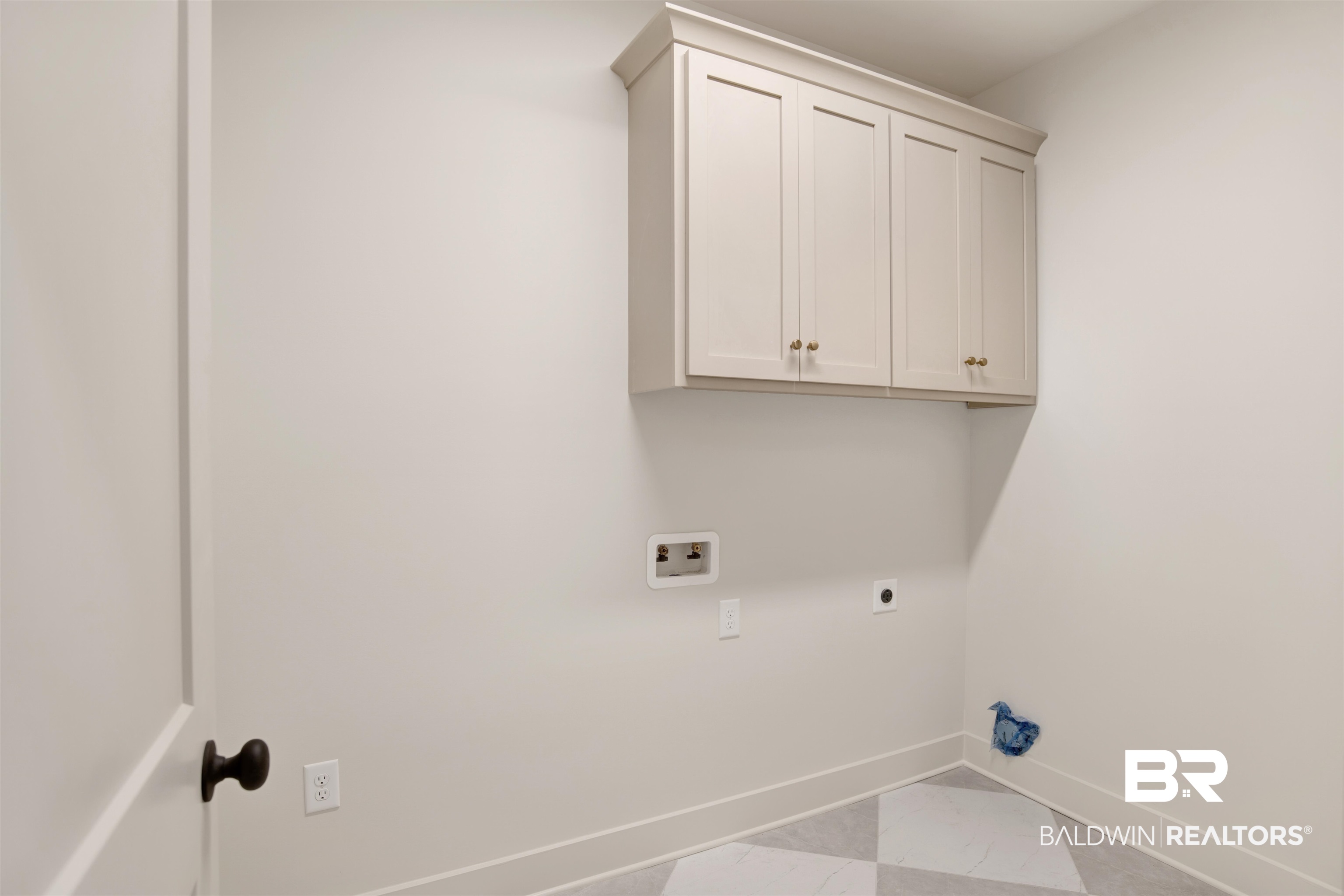 9275 Clarke Ridge Road Foley, AL 36535 - Photo 28 of 43 Laundry area featuring baseboards, electric dryer hookup, hookup for a washing machine, and cabinet space