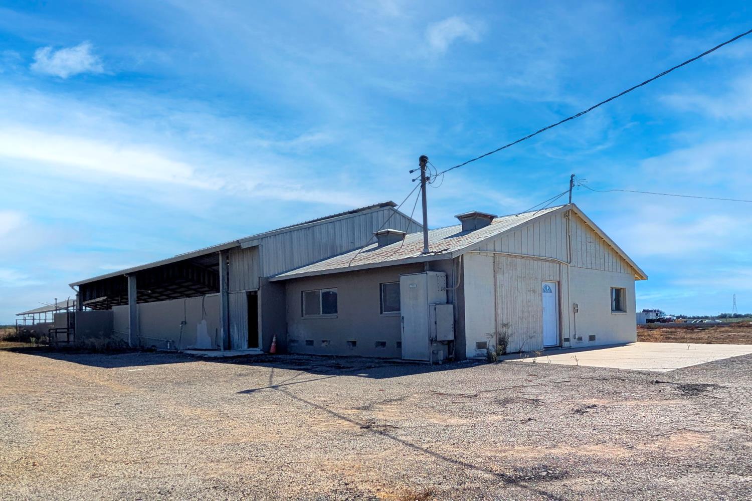 15918 North Jack Tone Road Lodi, CA 95240 - Photo 14 of 67 a front view of a house with a yard and garage