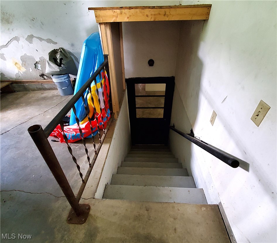 13075 Conquer Hill Road Byesville, OH 43723 - Photo 26 of 36 Staircase with concrete flooring