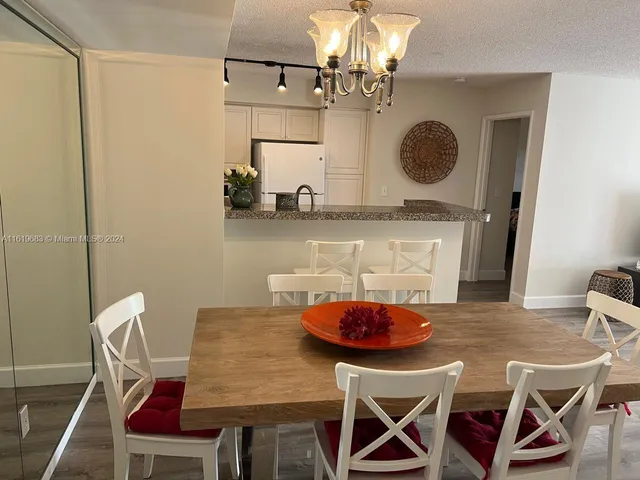 a table room with a table and chairs