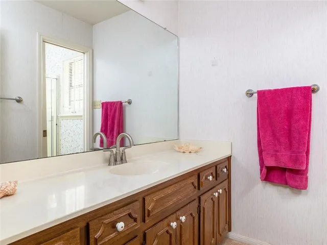 a bathroom with a sink and a mirror