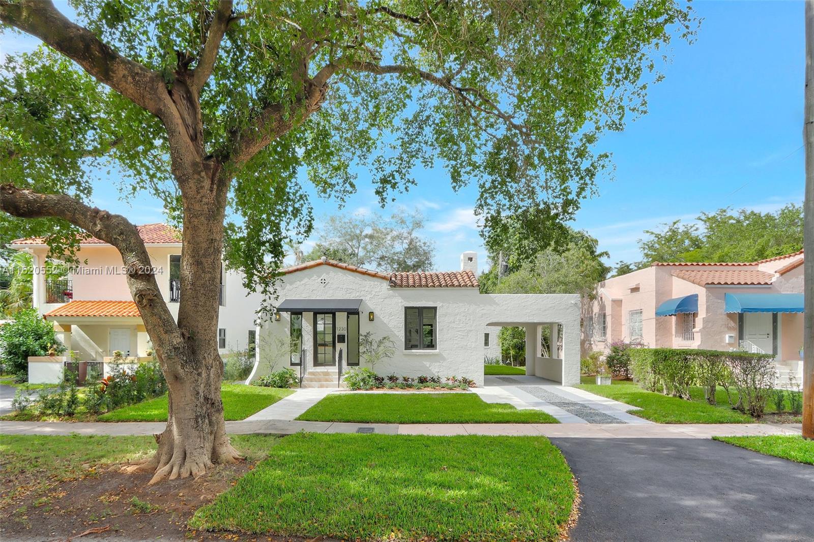Granada Coral Gables, FL 33134 - Photo 1 of 36 a front view of a house with a yard