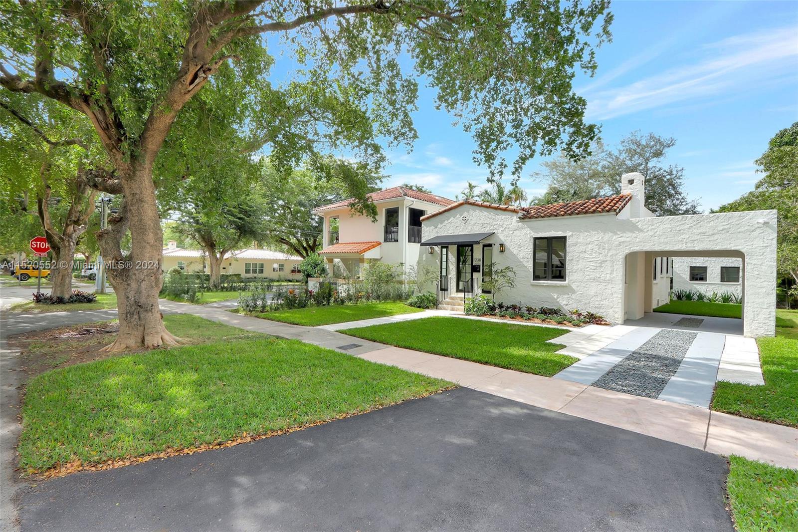 Granada Coral Gables, FL 33134 - Photo 2 of 36 a front view of house with yard and green space