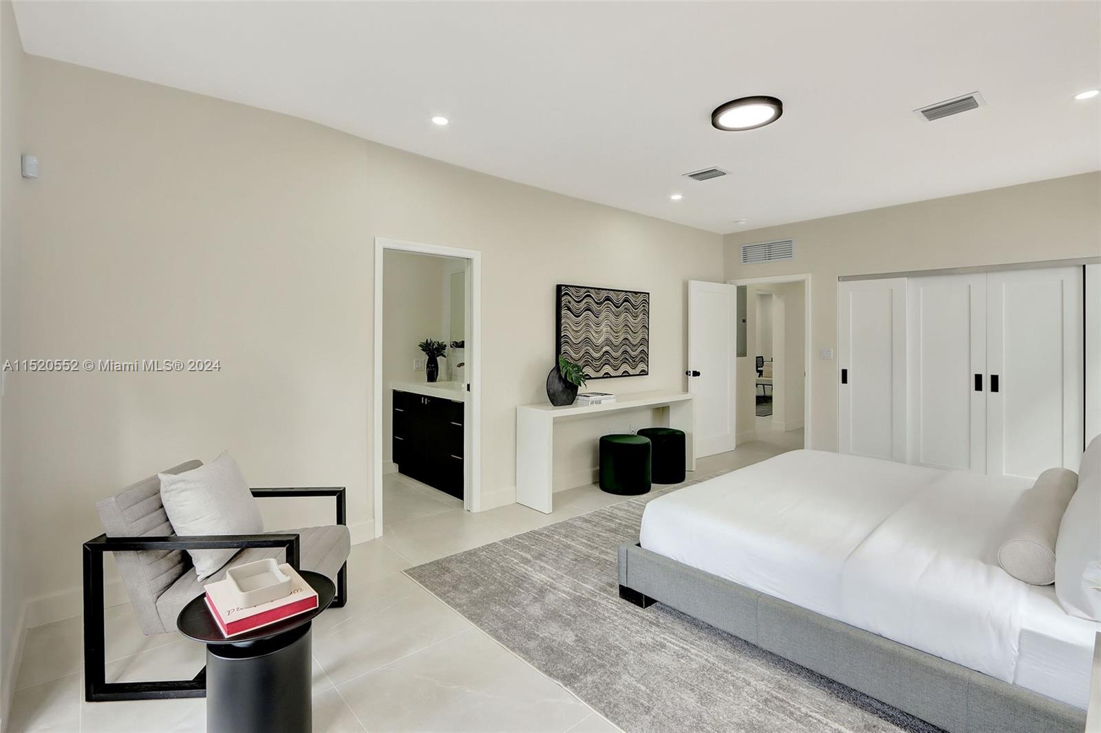 Granada Coral Gables, FL 33134 - Photo 22 of 36 a spacious bedroom with a bed and window