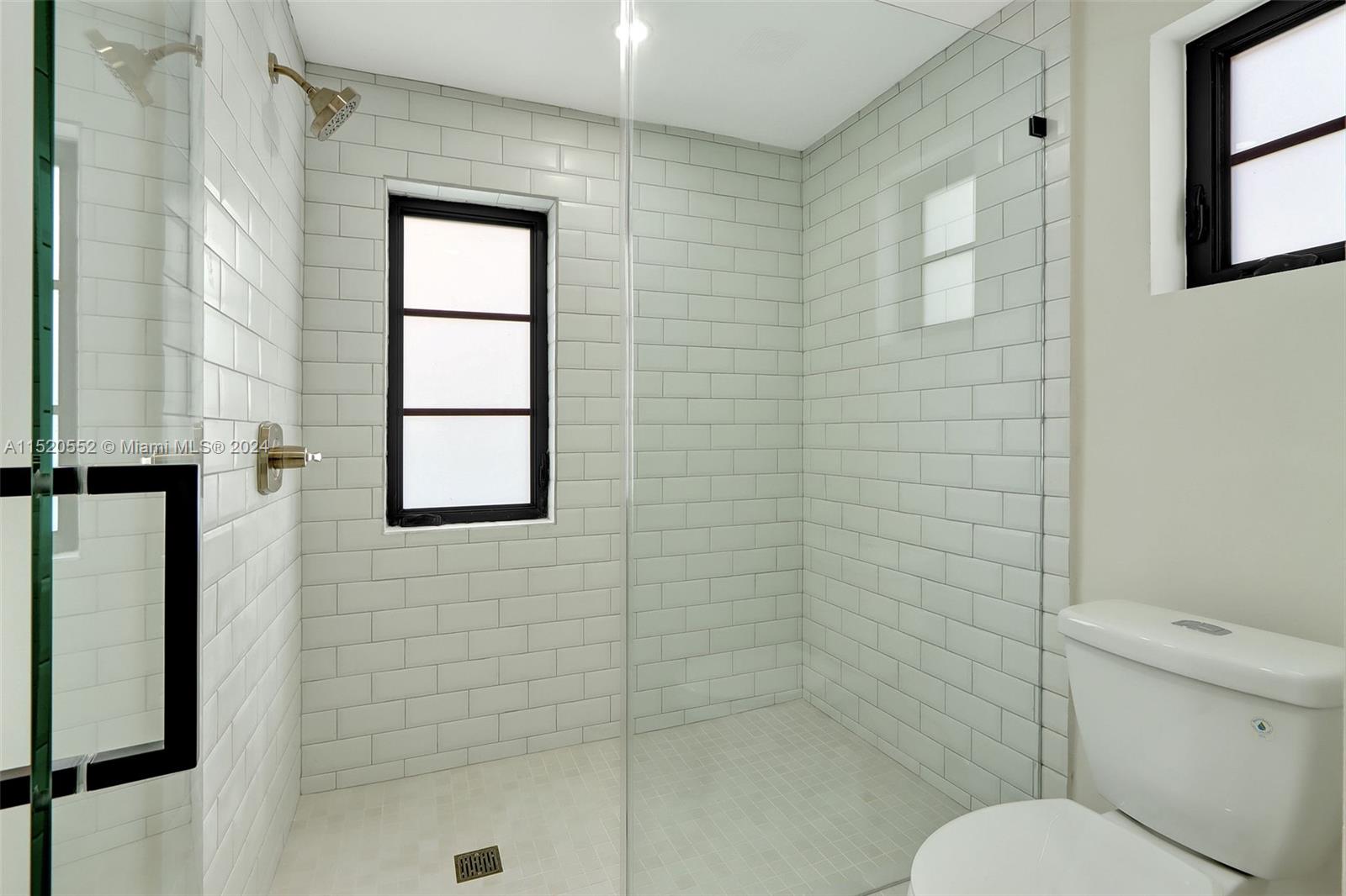 Granada Coral Gables, FL 33134 - Photo 25 of 36 a bathroom with a toilet and shower