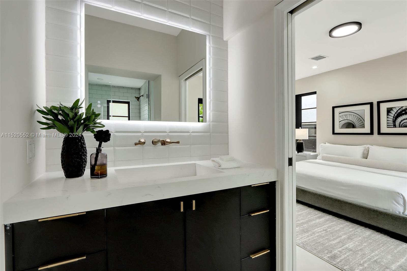 Granada Coral Gables, FL 33134 - Photo 26 of 36 a bathroom with a sink and a mirror