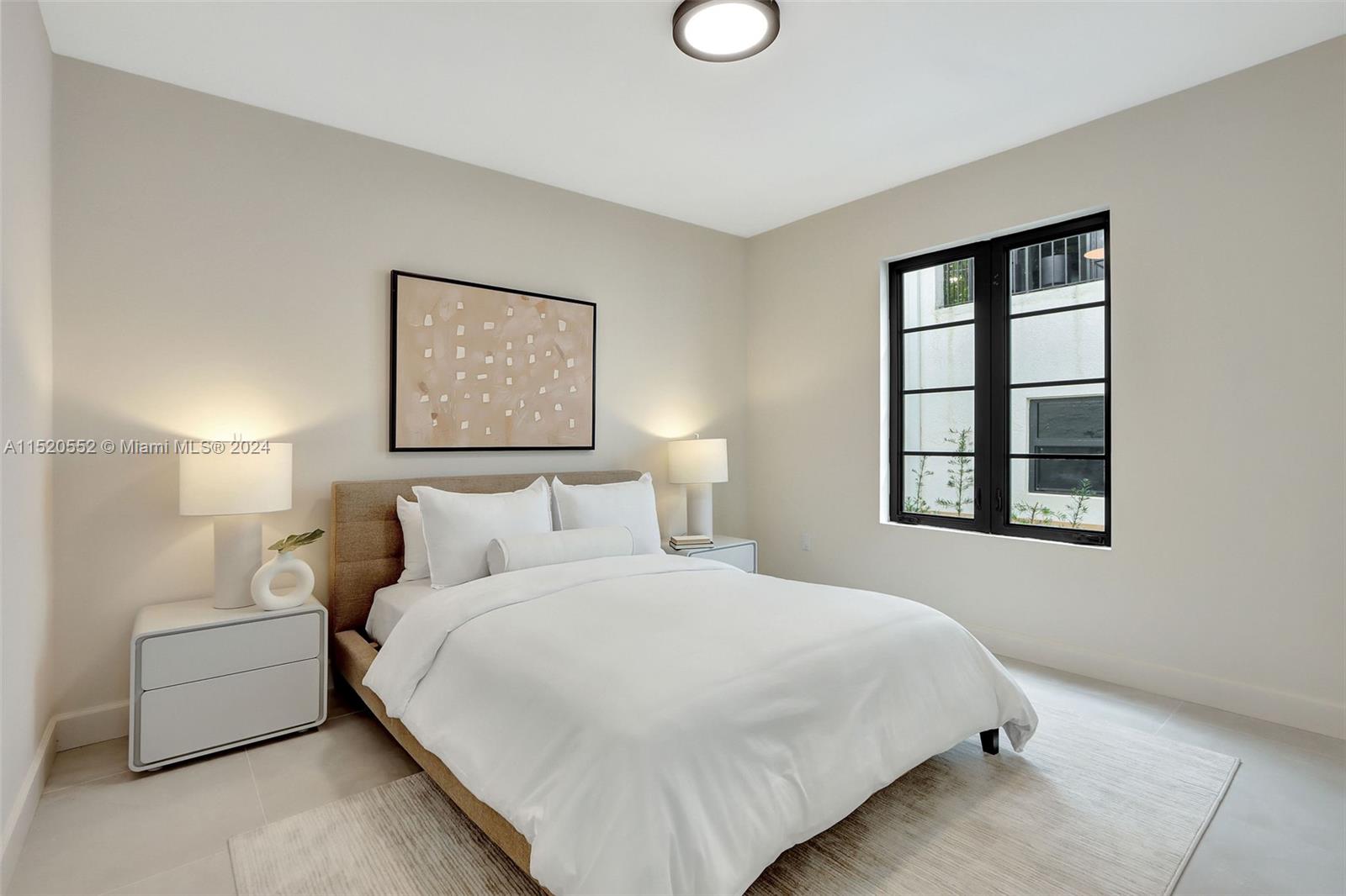 Granada Coral Gables, FL 33134 - Photo 27 of 36 a bedroom with a bed and a window