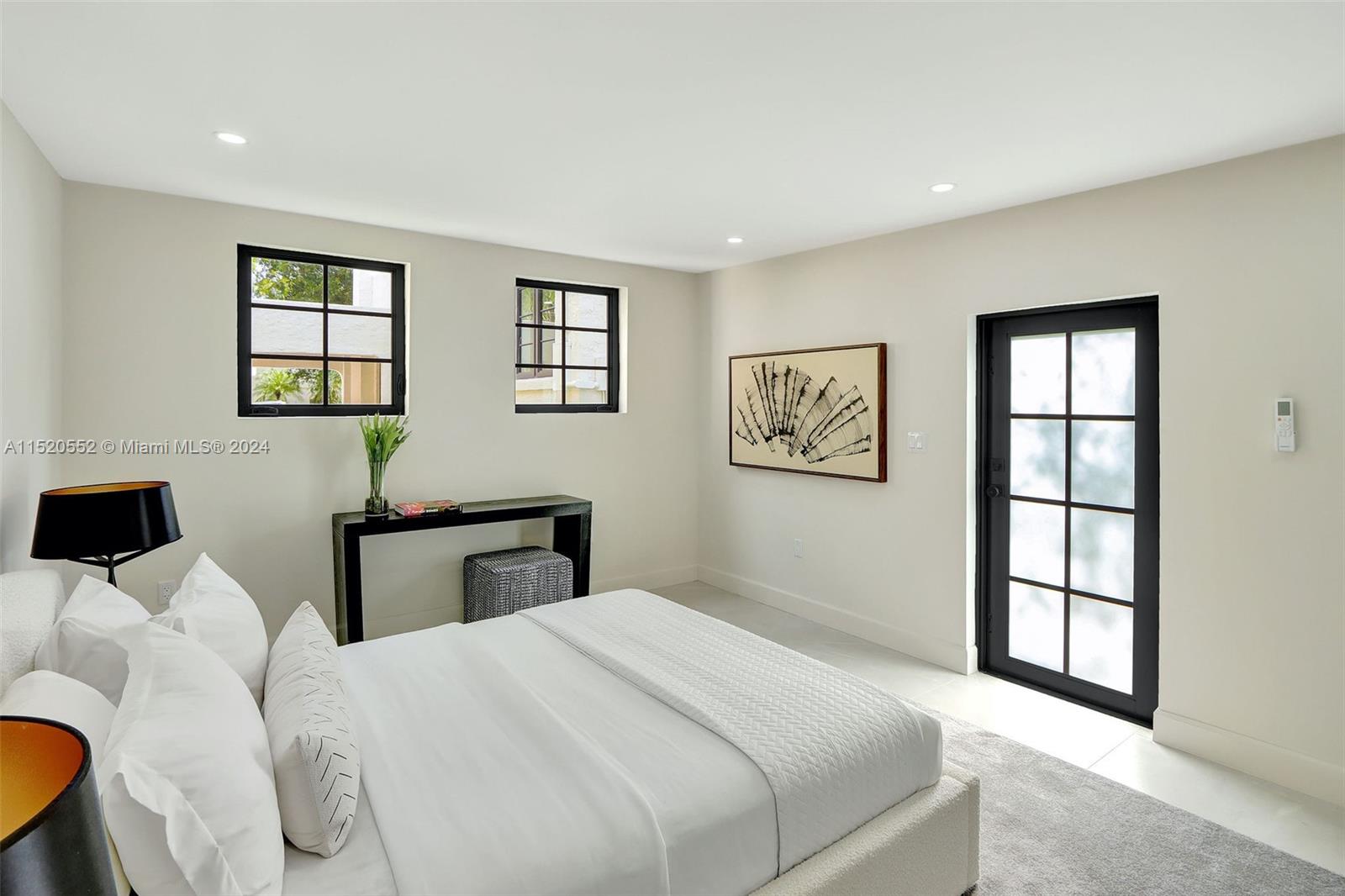 Granada Coral Gables, FL 33134 - Photo 9 of 36 a bedroom with a bed and a window