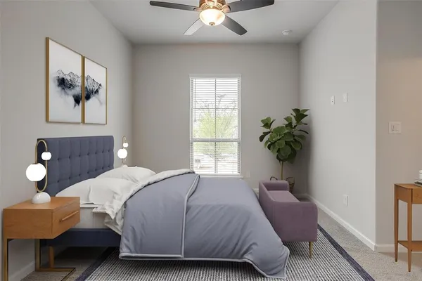 a bedroom with a bed and window