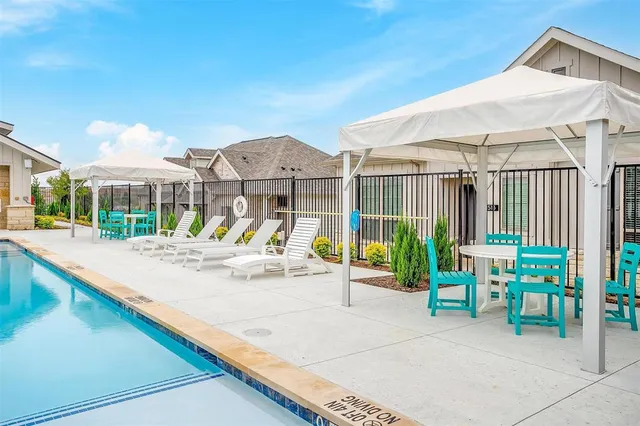 a front view of house with yard outdoor seating and slide