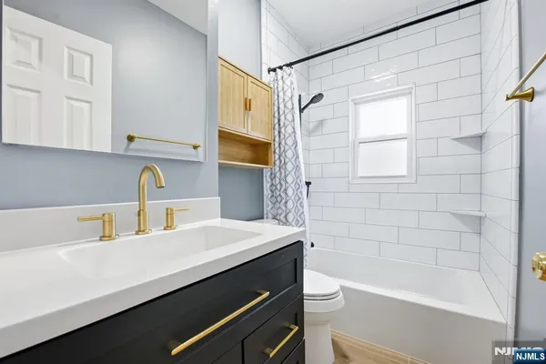 a bathroom with a sink a bathtub and a shower