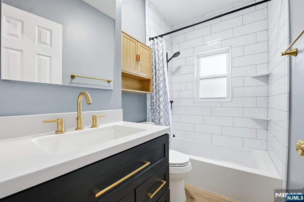 16 Munn Street, Unit 2 Montclair, NJ 07042 - Photo 12 of 21 a bathroom with a sink a bathtub and a shower