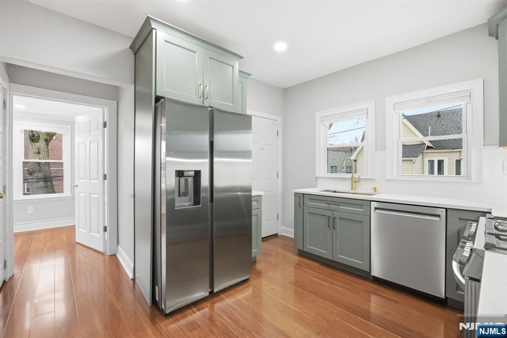 16 Munn Street, Unit 2 Montclair, NJ 07042 - Photo 6 of 21 a kitchen with stainless steel appliances granite countertop a refrigerator and a sink