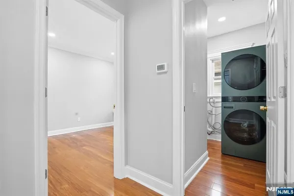 a view of a hallway with washer and dryer