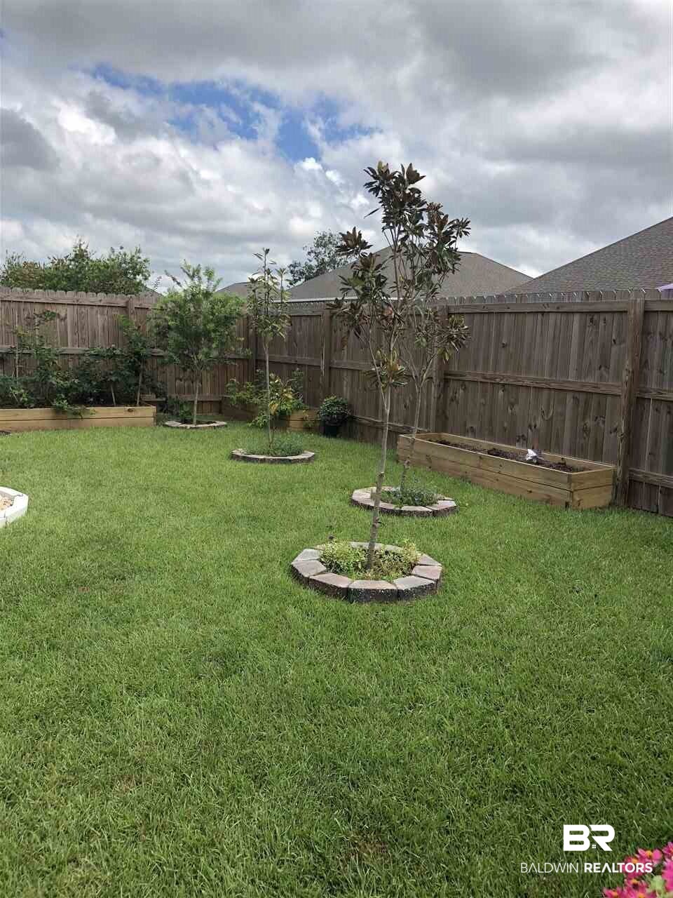 9424 Impala Drive Foley, AL 36535 - Photo 36 of 37 Rear Yard Landscaping