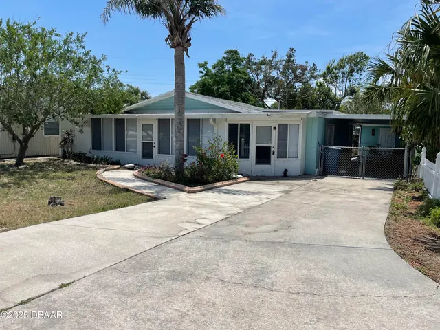 a house with yard in front of it