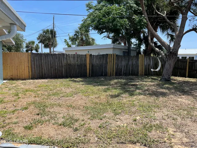 a view of backyard with tree