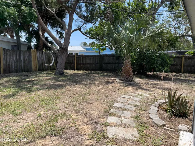 a view of backyard with green space