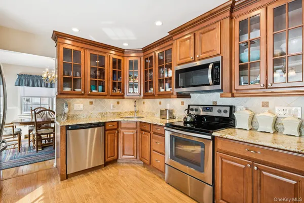 a kitchen with stainless steel appliances granite countertop a stove and a sink