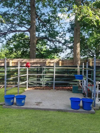 a view of yard with green yard and outdoor seating