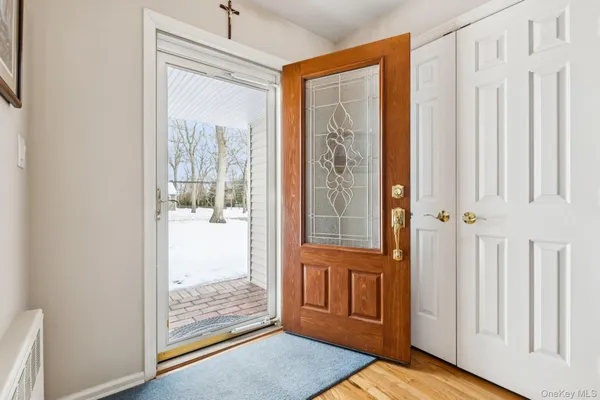 a view of a livingroom with furniture and staircase