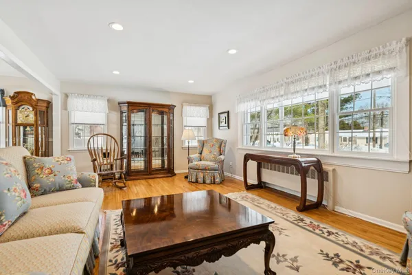 a living room with furniture and a table