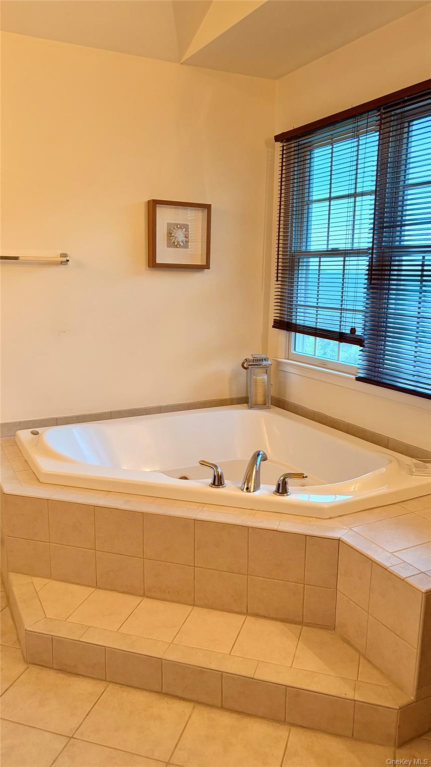 194 Devon Farms Road Stormville, NY 12582 - Photo 20 of 37 a bathroom with a bathtub and a shower