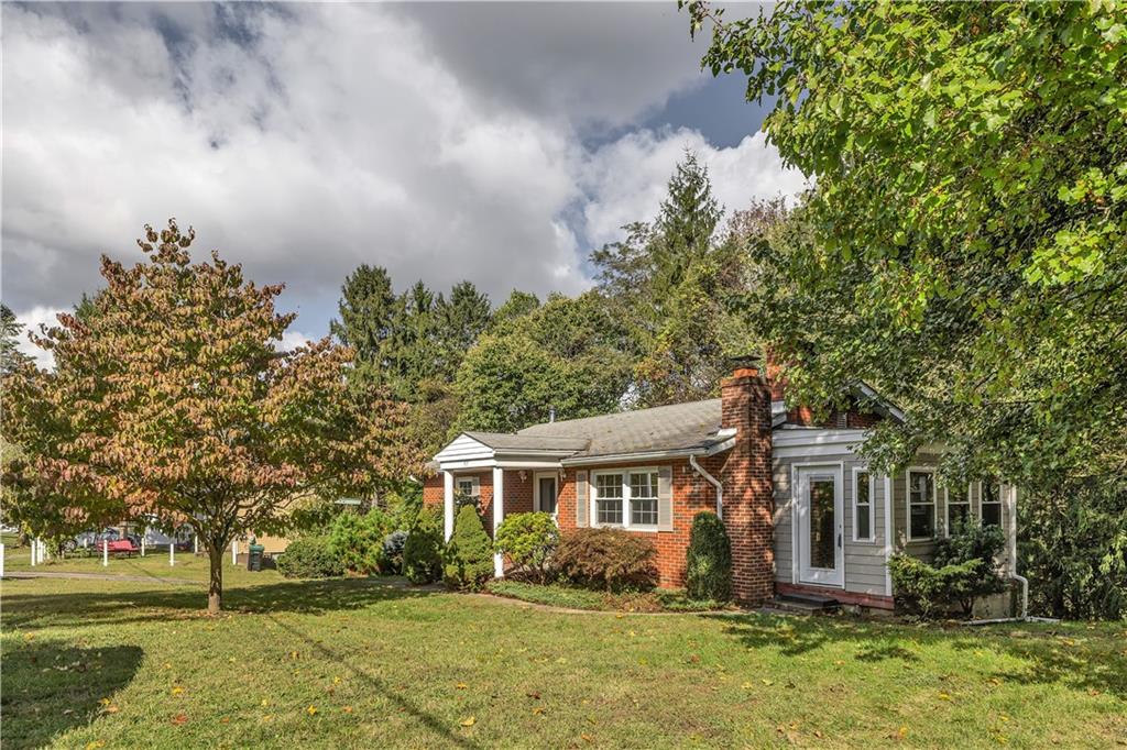 97 Emery Road Fredericktown, PA 15333 - Photo 2 of 23 front view of house with a yard