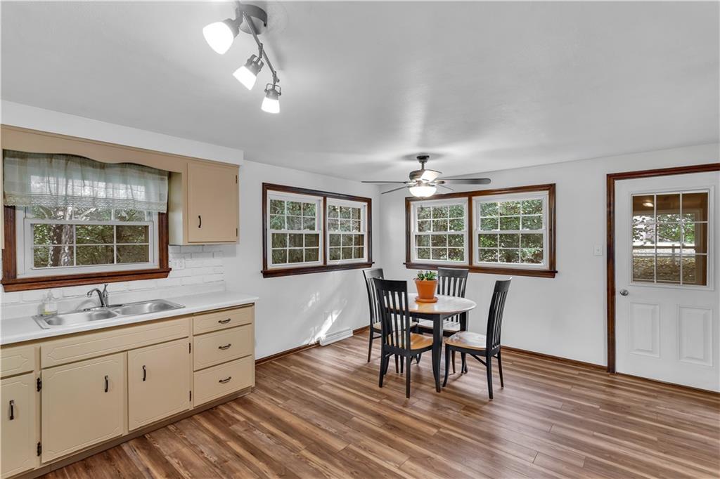 97 Emery Road Fredericktown, PA 15333 - Photo 7 of 23 a view of a dining room with furniture window and wooden floor
