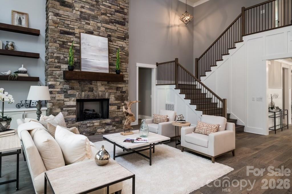116 Silver Falls Road Troutman, NC 28166 - Photo 14 of 46 a living room with furniture and a fireplace