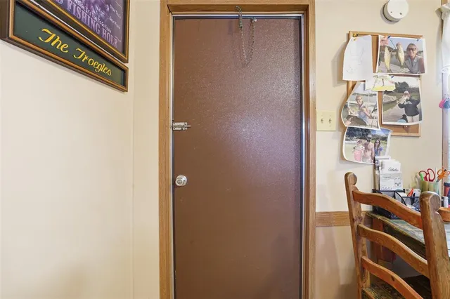 a view of an entryway with wooden floor