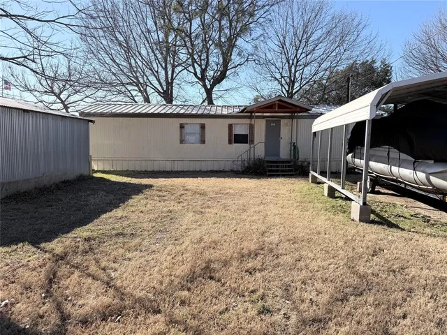 a house view with a backyard space