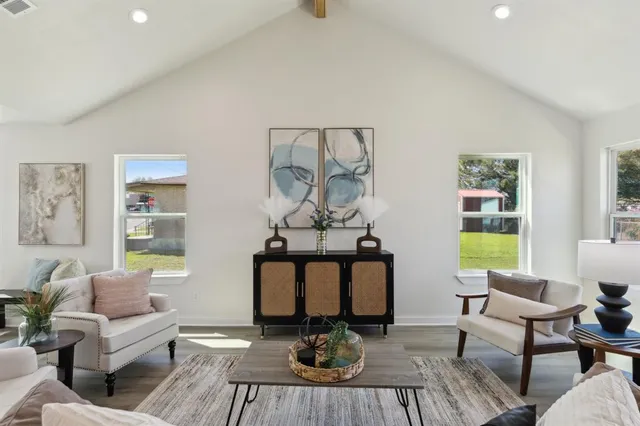 a view of a livingroom with furniture and a window