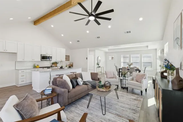 a living room with furniture white walls and white walls