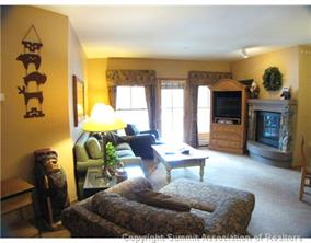 195 River Run Road, Unit 8004 Keystone, CO 80435 - Photo 2 of 16 a living room with furniture and a fireplace