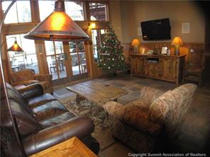 195 River Run Road, Unit 8004 Keystone, CO 80435 - Photo 11 of 16 a living room with furniture and a flat screen tv