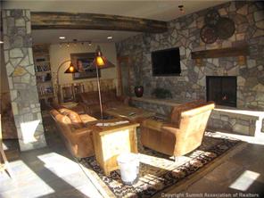 195 River Run Road, Unit 8004 Keystone, CO 80435 - Photo 12 of 16 a view of a livingroom with furniture and a fireplace