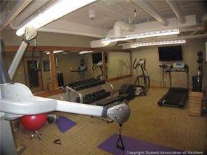 195 River Run Road, Unit 8004 Keystone, CO 80435 - Photo 13 of 16 a room with gym equipment and a mirror