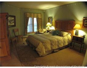 195 River Run Road, Unit 8004 Keystone, CO 80435 - Photo 5 of 16 a bedroom with a bed and window