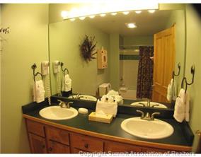 195 River Run Road, Unit 8004 Keystone, CO 80435 - Photo 6 of 16 a bathroom with a sink and a mirror
