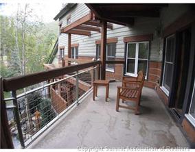 195 River Run Road, Unit 8004 Keystone, CO 80435 - Photo 10 of 16 a view of a chairs and table in the balcony