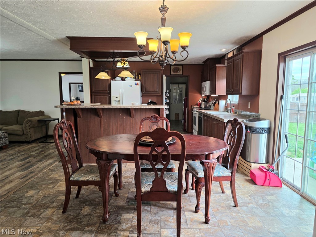 44 Scarce Fat Road Mineral Wells, WV 26150 - Photo 14 of 26 View of dining area with access to kitchen and living room